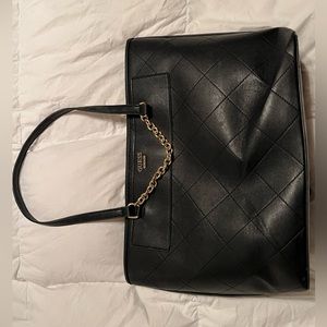 Guess purse/hand bag. Fits a laptop, barely used and like new.